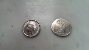A 20 cent piece, before and after getting run over by a tram.  The one on the right is the one that got run over.
